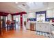Bright kitchen with white cabinets, blue tile backsplash, and stainless steel appliances at 10931 Clara Ln, St Petersburg, FL 33708