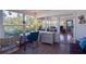 Sunroom with water views, workspace, and access to other rooms at 10931 Clara Ln, St Petersburg, FL 33708