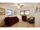 Cozy bedroom with a sofa and ceiling fan at 10931 Clara Ln, St Petersburg, FL 33708
