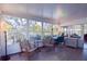 Bright sunroom with water views and workspace at 10931 Clara Ln, St Petersburg, FL 33708