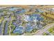 Aerial view of community with various amenities and landscaping at 5905 Shorebird Branch, Land O Lakes, FL 34638