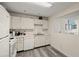 Updated kitchen with white cabinets and modern appliances at 2101 Fox Chase Blvd # 106, Palm Harbor, FL 34683