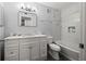 Updated bathroom with a bathtub and marble vanity at 2101 Fox Chase Blvd # 106, Palm Harbor, FL 34683