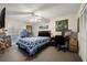 Bedroom with a full-size bed, work area, and access to a patio at 2101 Fox Chase Blvd # 106, Palm Harbor, FL 34683