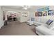 Spacious living room featuring an L-shaped sofa and hardwood floors at 2101 Fox Chase Blvd # 106, Palm Harbor, FL 34683