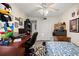 Bedroom with a twin-size bed, desk, and ample closet space at 2101 Fox Chase Blvd # 106, Palm Harbor, FL 34683