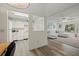 Open concept kitchen with white cabinets and appliances at 2101 Fox Chase Blvd # 106, Palm Harbor, FL 34683