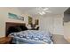 Bright bedroom with a queen bed, desk, and ample closet space at 2101 Fox Chase Blvd # 106, Palm Harbor, FL 34683