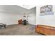 Open living room with wood-look floors, featuring a small table and chairs at 8378 Gibralter St, Spring Hill, FL 34608