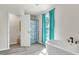 Relax in this spa-like bathroom, featuring a soaking tub and walk-in shower at 8378 Gibralter St, Spring Hill, FL 34608
