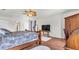 Main bedroom with hardwood floors, ceiling fan, and built-in wardrobe at 8378 Gibralter St, Spring Hill, FL 34608