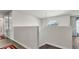 Upstairs hallway with wood-look floors and arched window at 8378 Gibralter St, Spring Hill, FL 34608