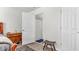 Well-lit bedroom with wood flooring and access to a full bathroom at 8378 Gibralter St, Spring Hill, FL 34608