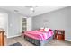 Bedroom with double bed, built-in shelves, and ensuite bathroom at 8378 Gibralter St, Spring Hill, FL 34608