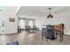 Living room with wood-look floors, wicker chairs, and a small table at 8378 Gibralter St, Spring Hill, FL 34608