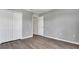 Well-lit bedroom with wood-look floors and double doors at 8378 Gibralter St, Spring Hill, FL 34608