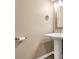 Simple bathroom with pedestal sink and light beige walls at 8378 Gibralter St, Spring Hill, FL 34608