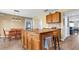 Kitchen boasts an island with granite countertops and wood cabinets at 8378 Gibralter St, Spring Hill, FL 34608