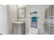 Modern bathroom with white vanity, toilet, and shower at 8378 Gibralter St, Spring Hill, FL 34608