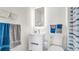 Modern bathroom with white vanity and shower at 8378 Gibralter St, Spring Hill, FL 34608