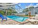 Inviting swimming pool with spacious patio and lounge chairs at 8378 Gibralter St, Spring Hill, FL 34608