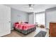 Bright bedroom with a double bed and hardwood floors at 8378 Gibralter St, Spring Hill, FL 34608