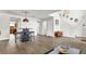 Open living room with a view into the kitchen and a small table and chairs at 8378 Gibralter St, Spring Hill, FL 34608