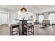 Open living area with wood-look floors, and a small table and chairs at 8378 Gibralter St, Spring Hill, FL 34608
