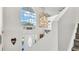 Inviting entryway with a large window, chandelier, and decorative wall art at 8378 Gibralter St, Spring Hill, FL 34608