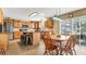 Eat-in kitchen with island, stainless steel appliances, and wood cabinets at 8378 Gibralter St, Spring Hill, FL 34608