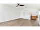 Spacious living area with wood-look flooring, double closets and ceiling fan at 8378 Gibralter St, Spring Hill, FL 34608