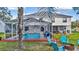 Screened pool and patio area with fire pit and lounge chairs at 8378 Gibralter St, Spring Hill, FL 34608
