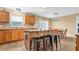 Kitchen with island, stainless steel appliances, and wood cabinets at 8378 Gibralter St, Spring Hill, FL 34608