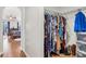 Large walk-in closet with ample hanging space and shelving at 8378 Gibralter St, Spring Hill, FL 34608