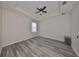 Spacious bedroom with ceiling fan and wood-look flooring at 497 Spotted Slipper Pl, Ruskin, FL 33570