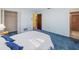 Bright bedroom with blue carpet and a double bed at 112 N Bay Hills Blvd, Safety Harbor, FL 34695