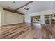 Living room with hardwood floors and sliding glass doors at 10520 Collar Dr, San Antonio, FL 33576
