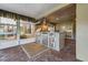 Outdoor kitchen with stainless steel appliances and brick-paved floor at 10520 Collar Dr, San Antonio, FL 33576