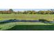 Backyard with grassy area and a small pond at 10520 Collar Dr, San Antonio, FL 33576