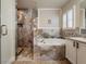 Spa-like bathroom featuring a soaking tub and walk-in shower at 10520 Collar Dr, San Antonio, FL 33576