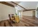Bright dining area with hardwood floors and a charming round table at 10520 Collar Dr, San Antonio, FL 33576