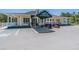Community clubhouse with golf cart parking at 10520 Collar Dr, San Antonio, FL 33576