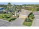Single-Gathering home with landscaped yard and driveway at 10520 Collar Dr, San Antonio, FL 33576