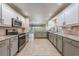 Modern kitchen with stainless steel appliances and granite countertops at 10520 Collar Dr, San Antonio, FL 33576