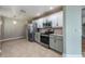 Modern kitchen with granite countertops and stainless steel appliances at 10520 Collar Dr, San Antonio, FL 33576