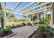 Relaxing covered patio with pergola and lush landscaping at 10520 Collar Dr, San Antonio, FL 33576