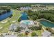 Aerial view of community clubhouse and golf course at 10520 Collar Dr, San Antonio, FL 33576