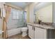 Clean bathroom with a tub/shower combo and updated vanity at 10520 Collar Dr, San Antonio, FL 33576