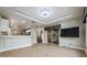 Spacious Gathering room featuring a large TV and tile floors at 10520 Collar Dr, San Antonio, FL 33576