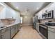 Spacious kitchen featuring granite countertops and stainless steel appliances at 10520 Collar Dr, San Antonio, FL 33576
